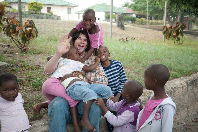 Joshua serving children on a mission trip